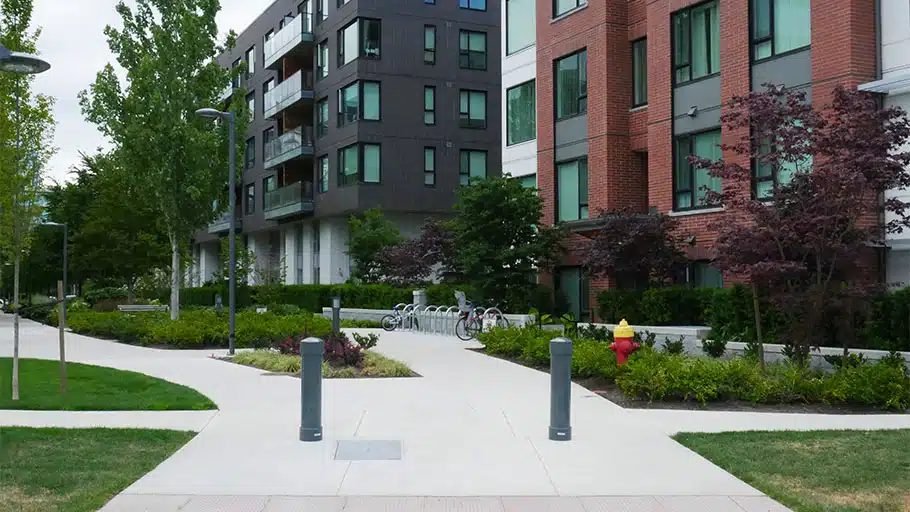 Apartment walkway with bollards, defined paths and bike parking